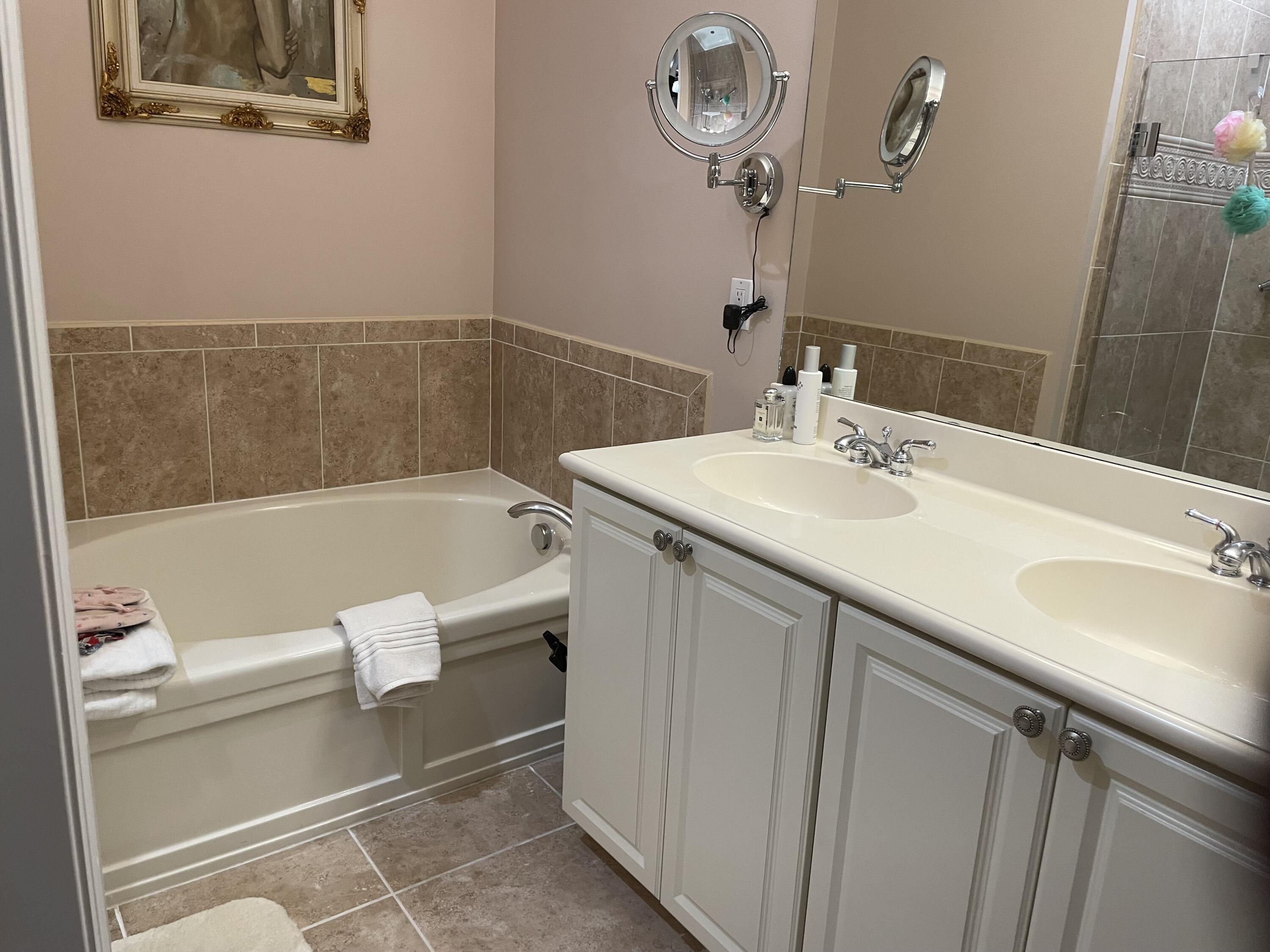 1157 Northwest 18th Avenue Boca Raton, FL 33431 - Photo 16 of 22 a bathroom with a sink and a mirror