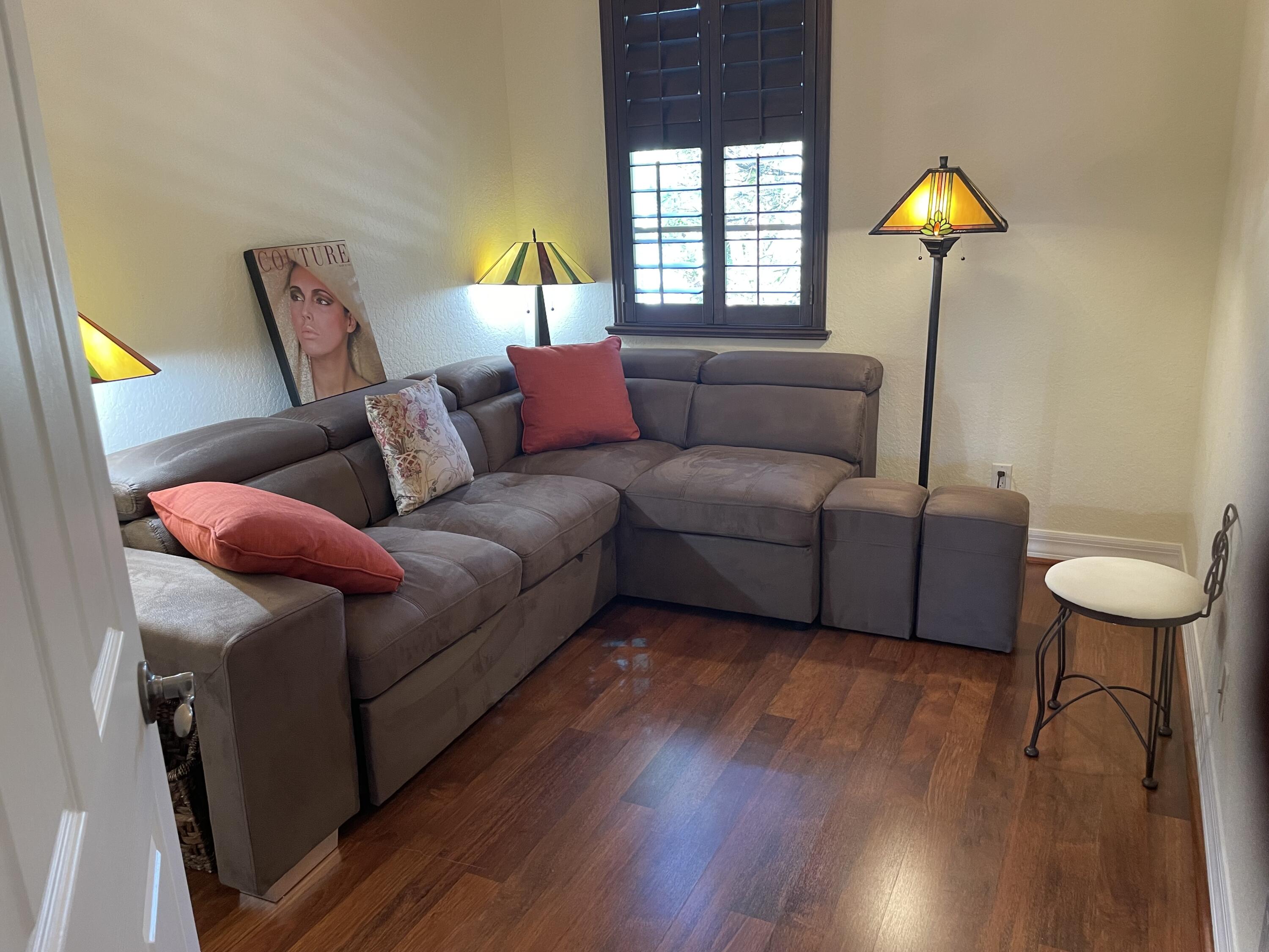 1157 Northwest 18th Avenue Boca Raton, FL 33431 - Photo 20 of 22 a living room with furniture and a lamp
