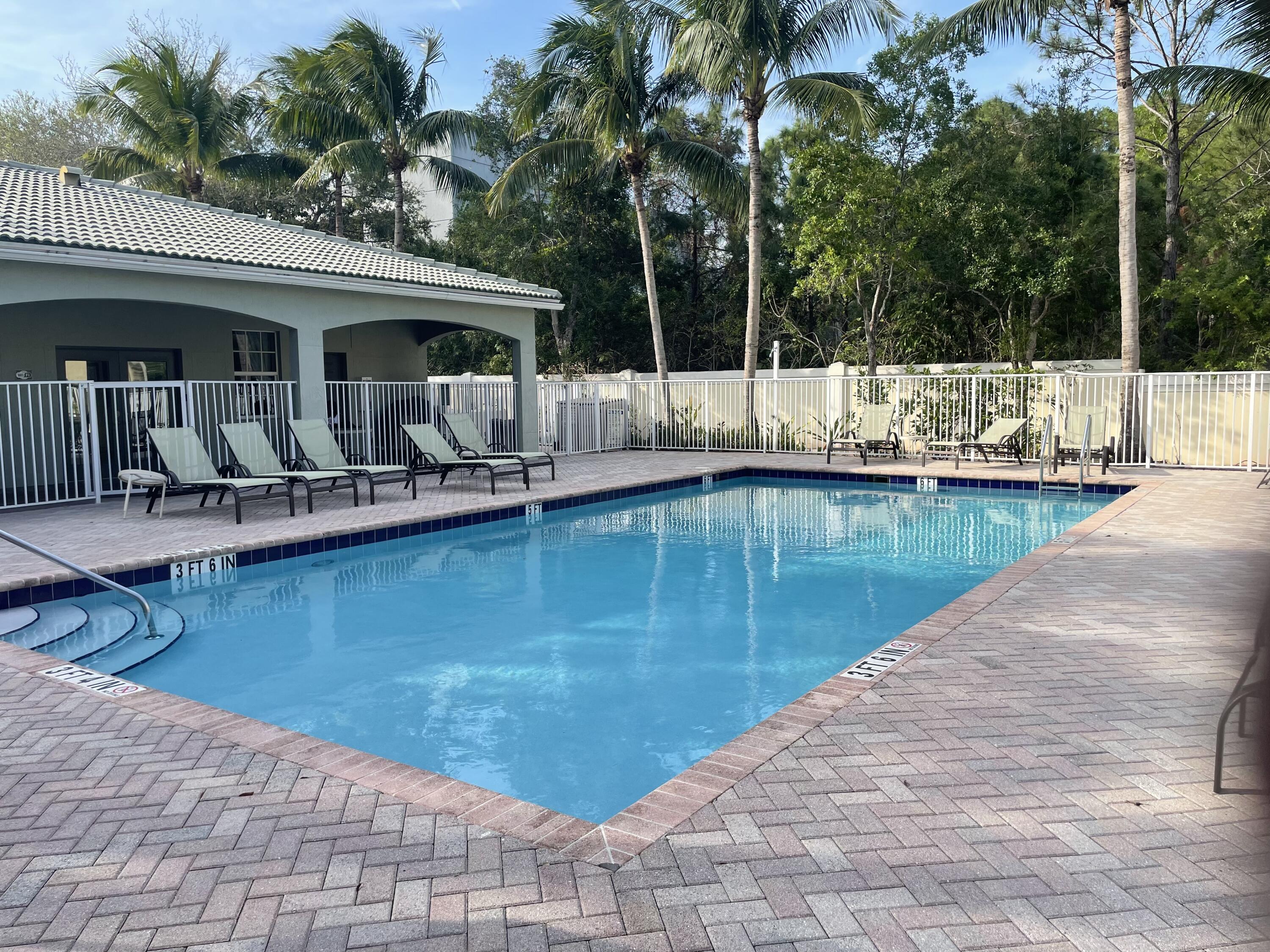1157 Northwest 18th Avenue Boca Raton, FL 33431 - Photo 22 of 22 a swimming pool with outdoor seating and yard