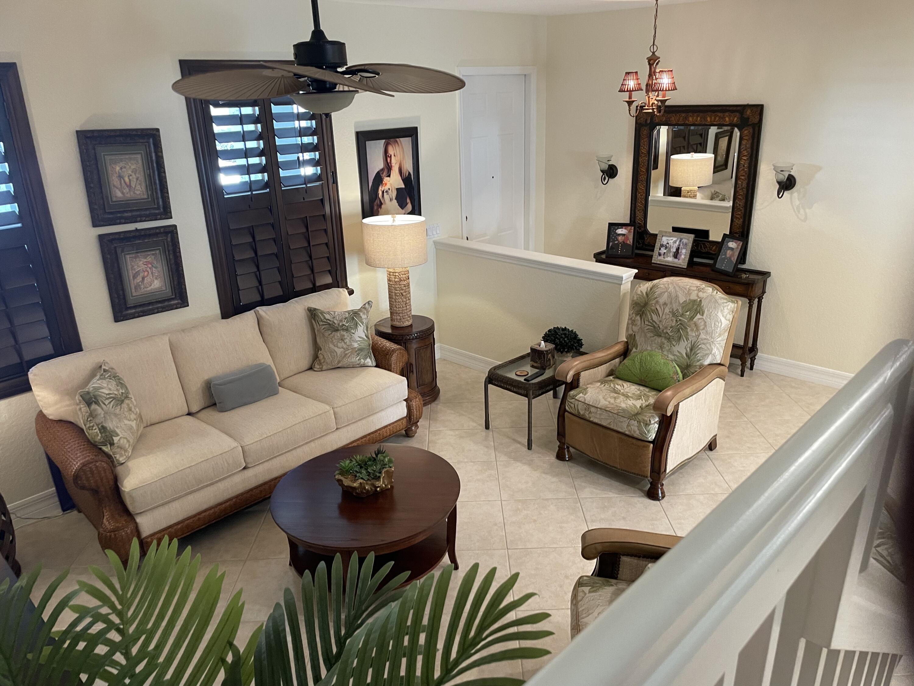 1157 Northwest 18th Avenue Boca Raton, FL 33431 - Photo 6 of 22 a living room with furniture and wooden floor