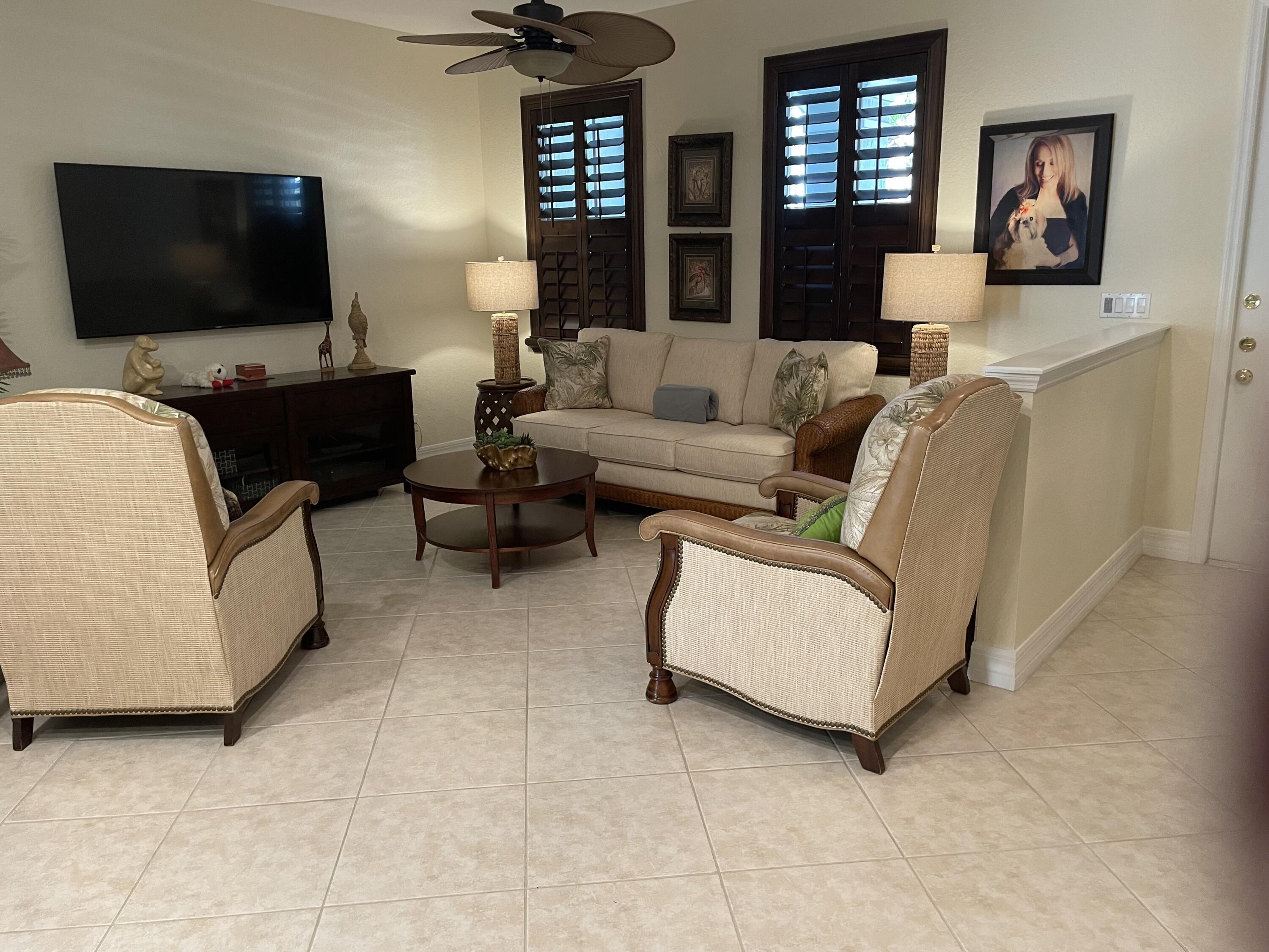 1157 Northwest 18th Avenue Boca Raton, FL 33431 - Photo 7 of 22 a living room with furniture and a flat screen tv