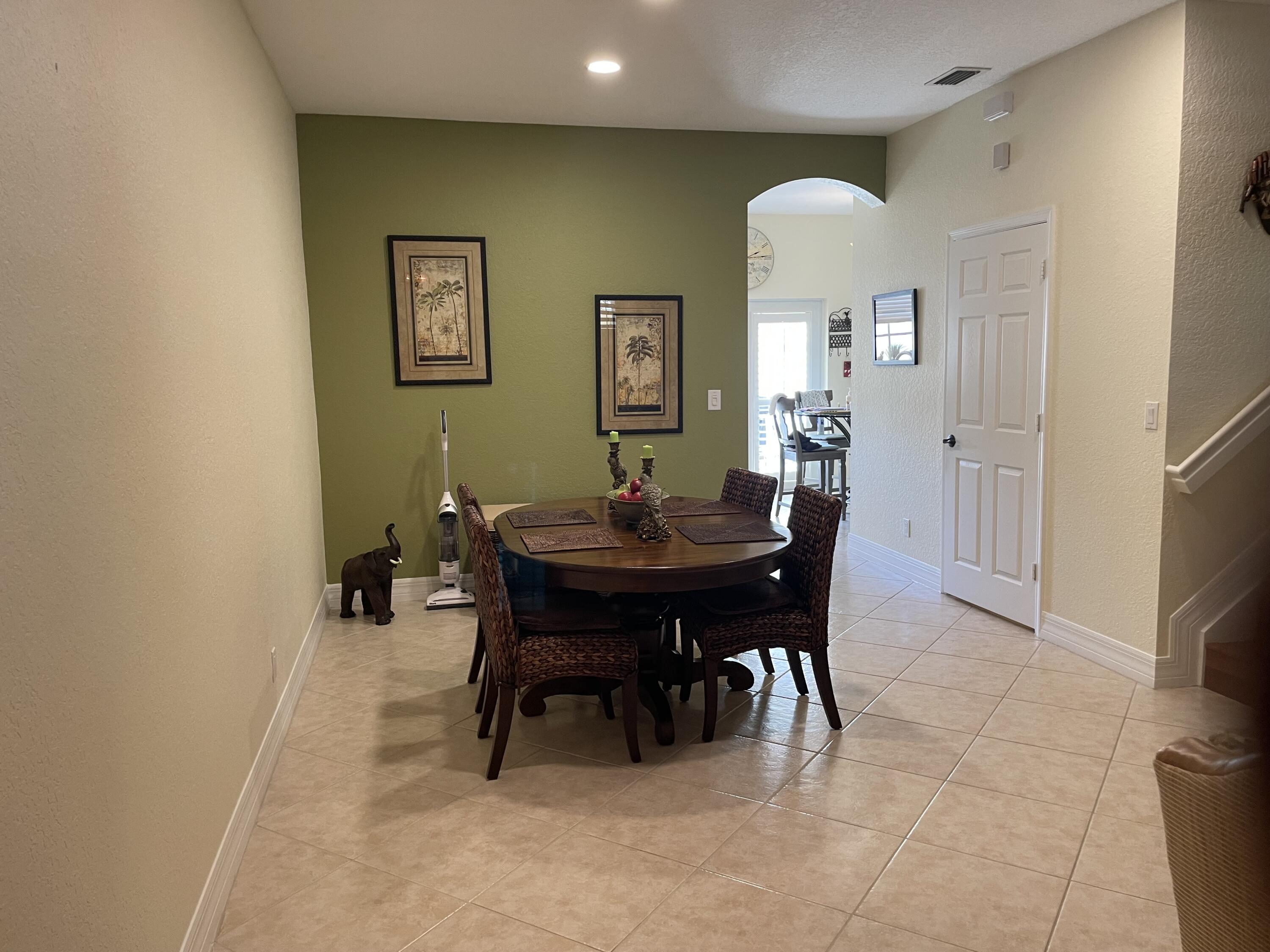 1157 Northwest 18th Avenue Boca Raton, FL 33431 - Photo 9 of 22 a view of a dining room with furniture