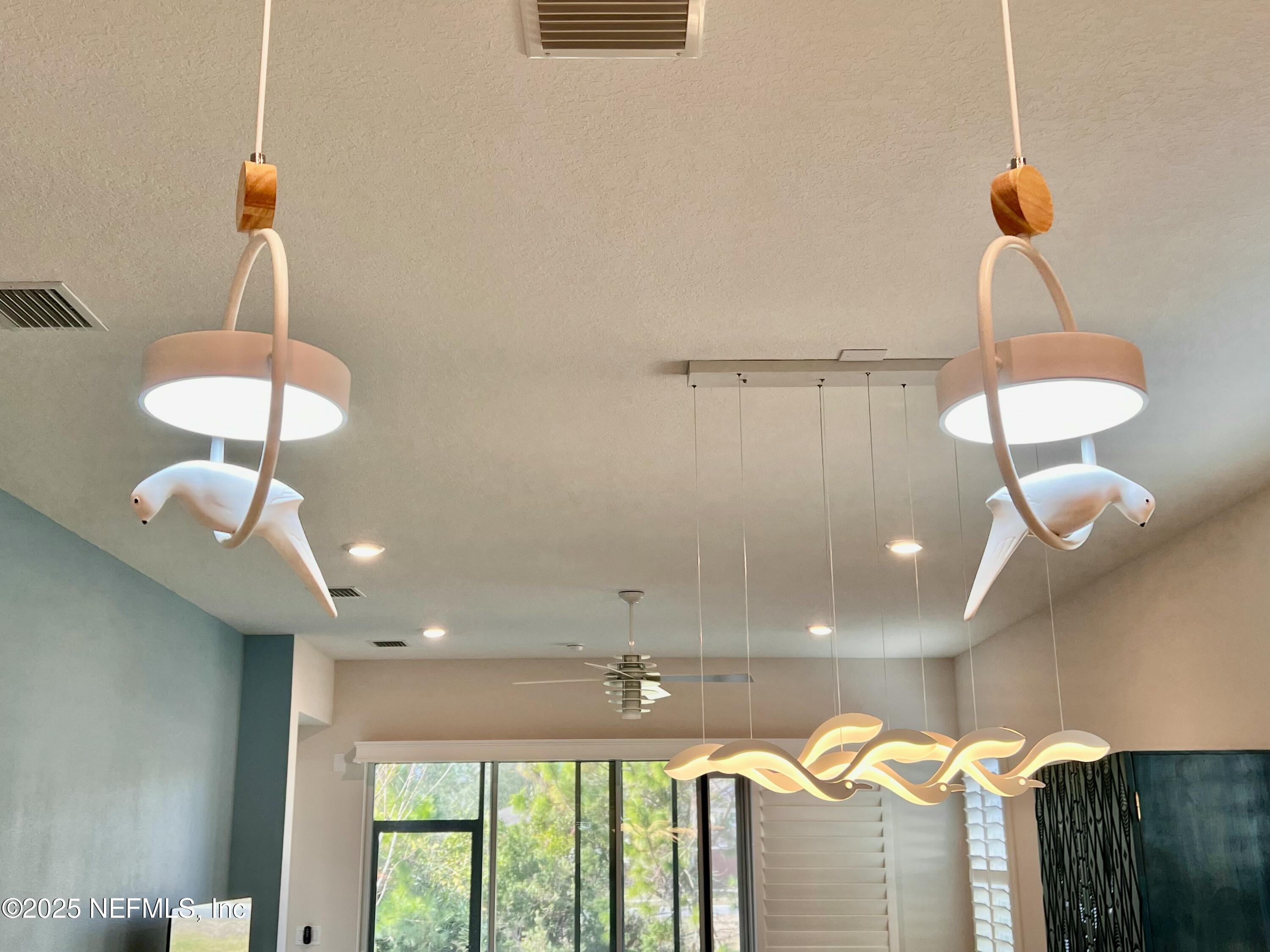 3274 Bailey Ann Drive Ormond Beach, FL 32174 - Photo 14 of 46 a view of a room with a chandelier