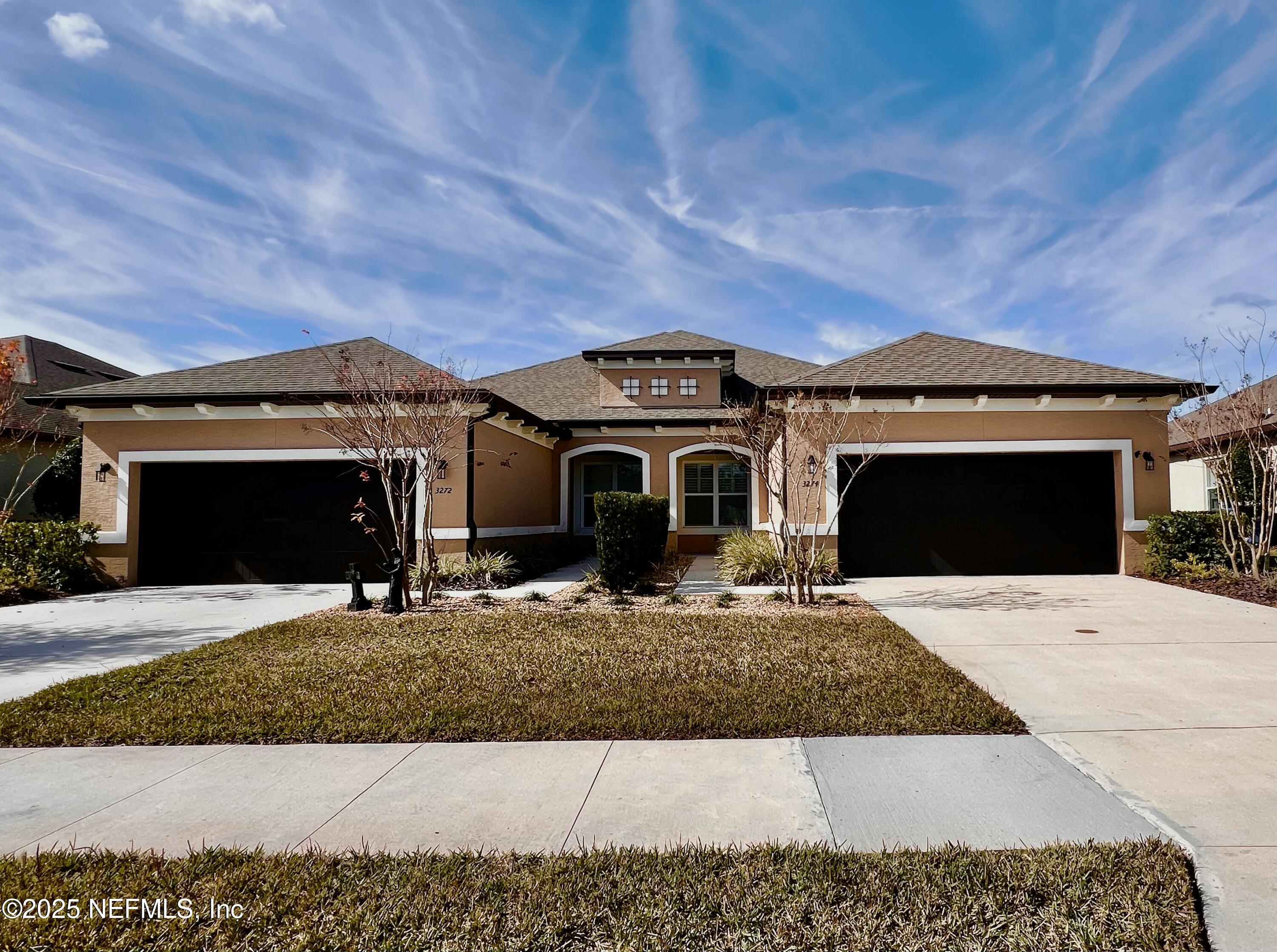 3274 Bailey Ann Drive Ormond Beach, FL 32174 - Photo 2 of 46 a front view of a house with a yard and garage