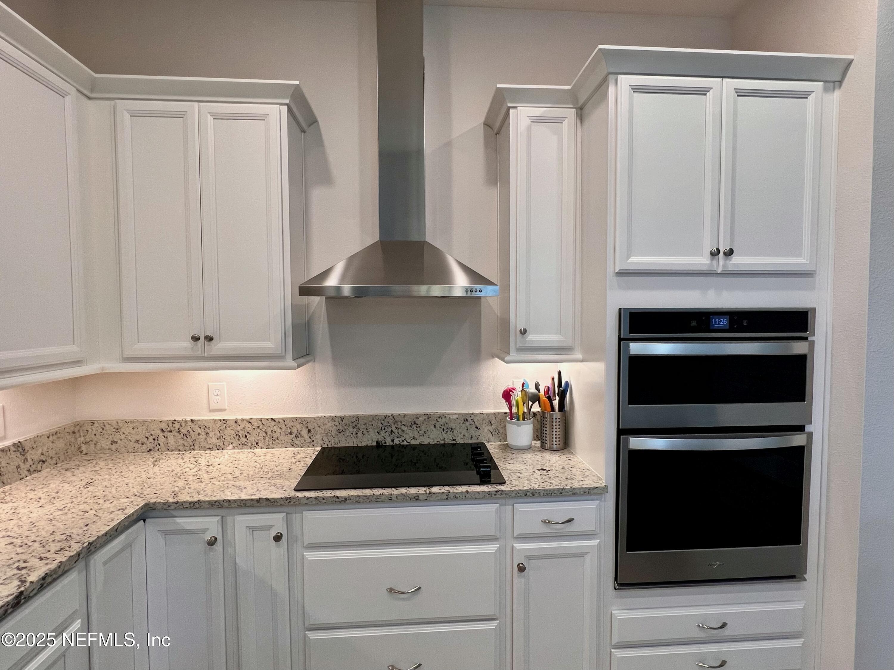 3274 Bailey Ann Drive Ormond Beach, FL 32174 - Photo 9 of 46 a kitchen with granite countertop a stove and a refrigerator