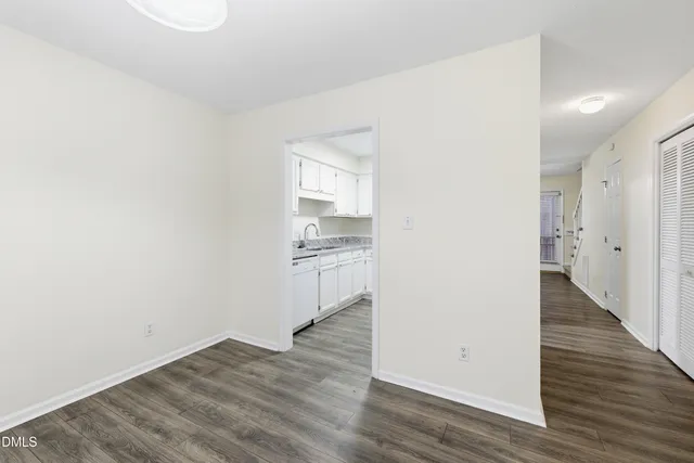 a view of a kitchen with wooden floor
