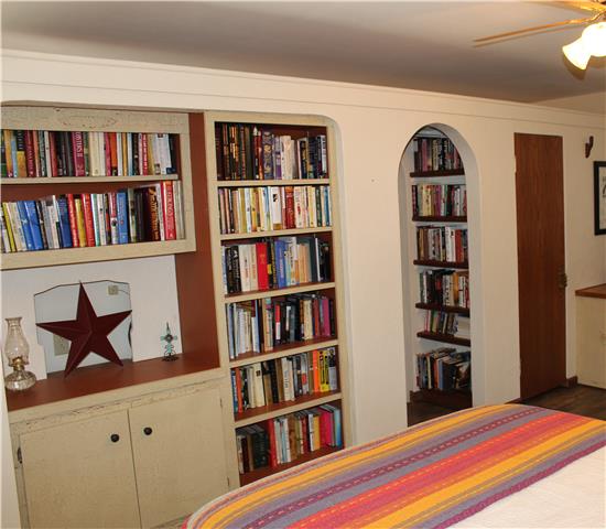 6858 Choctaw Road College Grove, TN 37046 - Photo 2 of 12 This room can be used as a bedroom or office. It has built in bookcases and a desk. A very nice addition to a house this size.