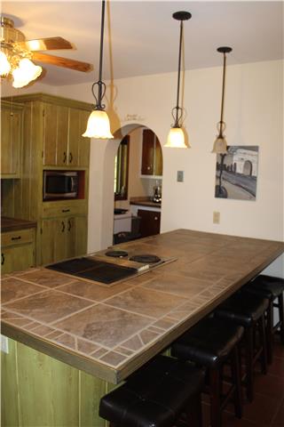 6858 Choctaw Road College Grove, TN 37046 - Photo 3 of 12 Nice sized kitchen with a bakers room. Lots and lots of storage in this kitchen, not typical in a house this size!