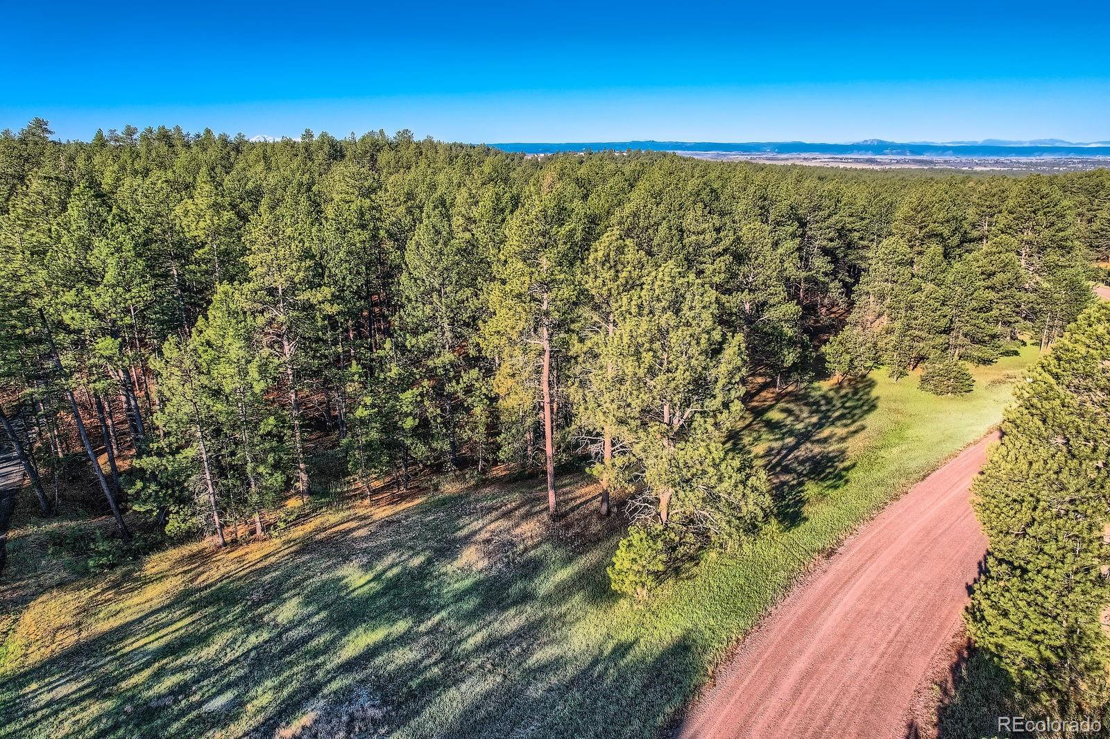 856 Woodridge Road Franktown, CO 80116 - Photo 14 of 28 a view of an outdoor space and mountain view