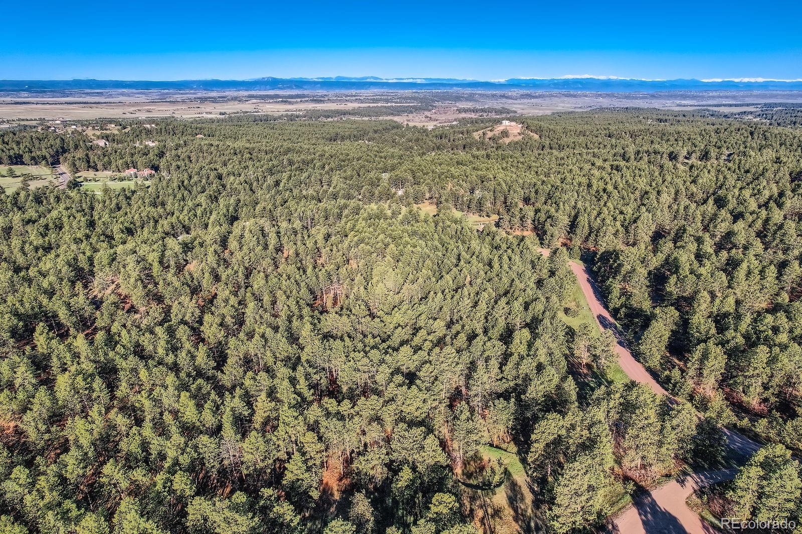 856 Woodridge Road Franktown, CO 80116 - Photo 18 of 28 a view of a city with an ocean