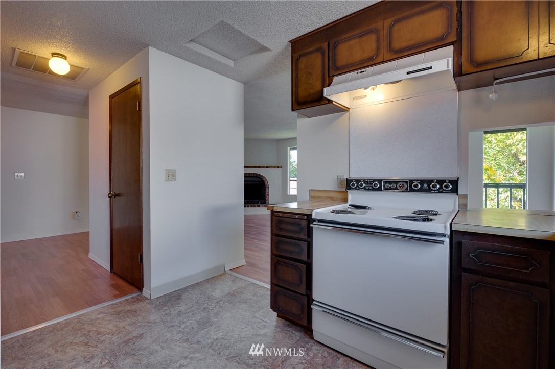 709 Sheridan Road Bremerton, WA 98310 - Photo 11 of 19 a kitchen with a sink and cabinets