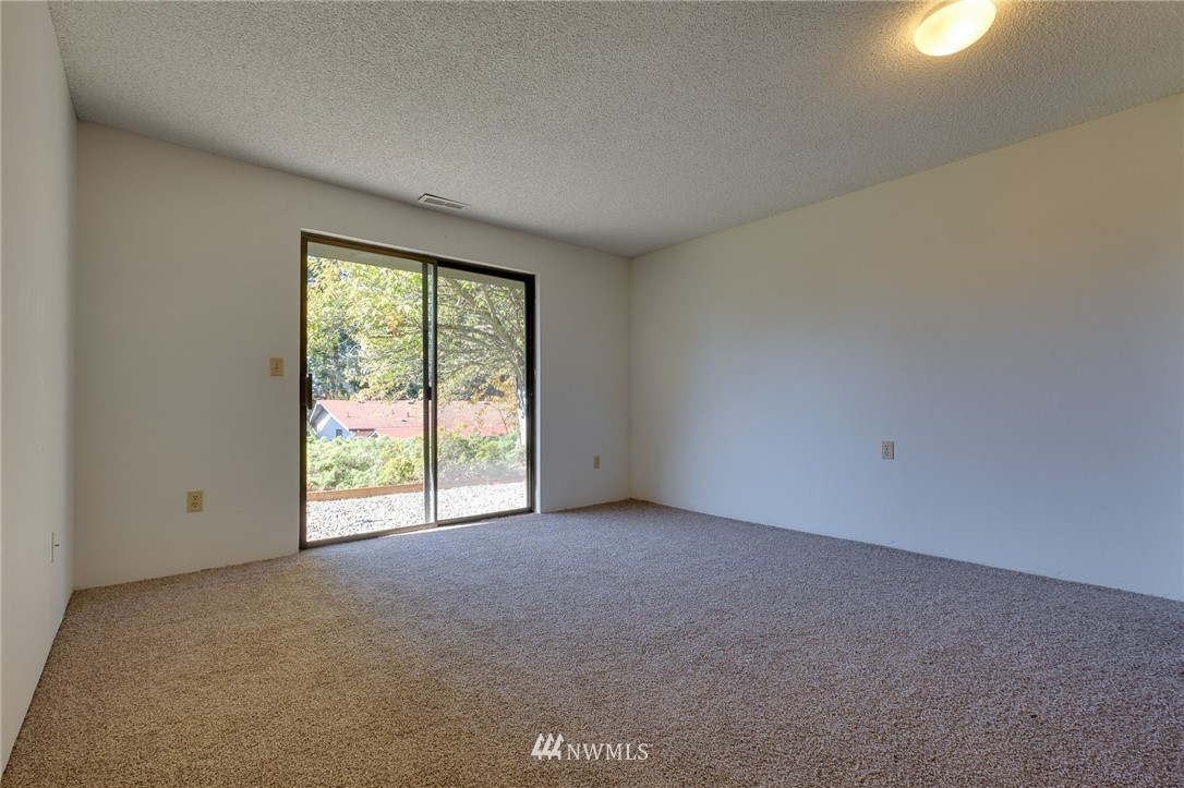 709 Sheridan Road Bremerton, WA 98310 - Photo 15 of 19 a view of an empty room with a window