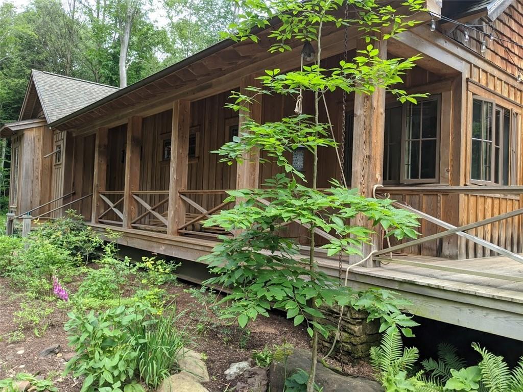93 Wonder Lane Punxsutawney, PA 15767 - Photo 15 of 19 a house with a yard and potted plants