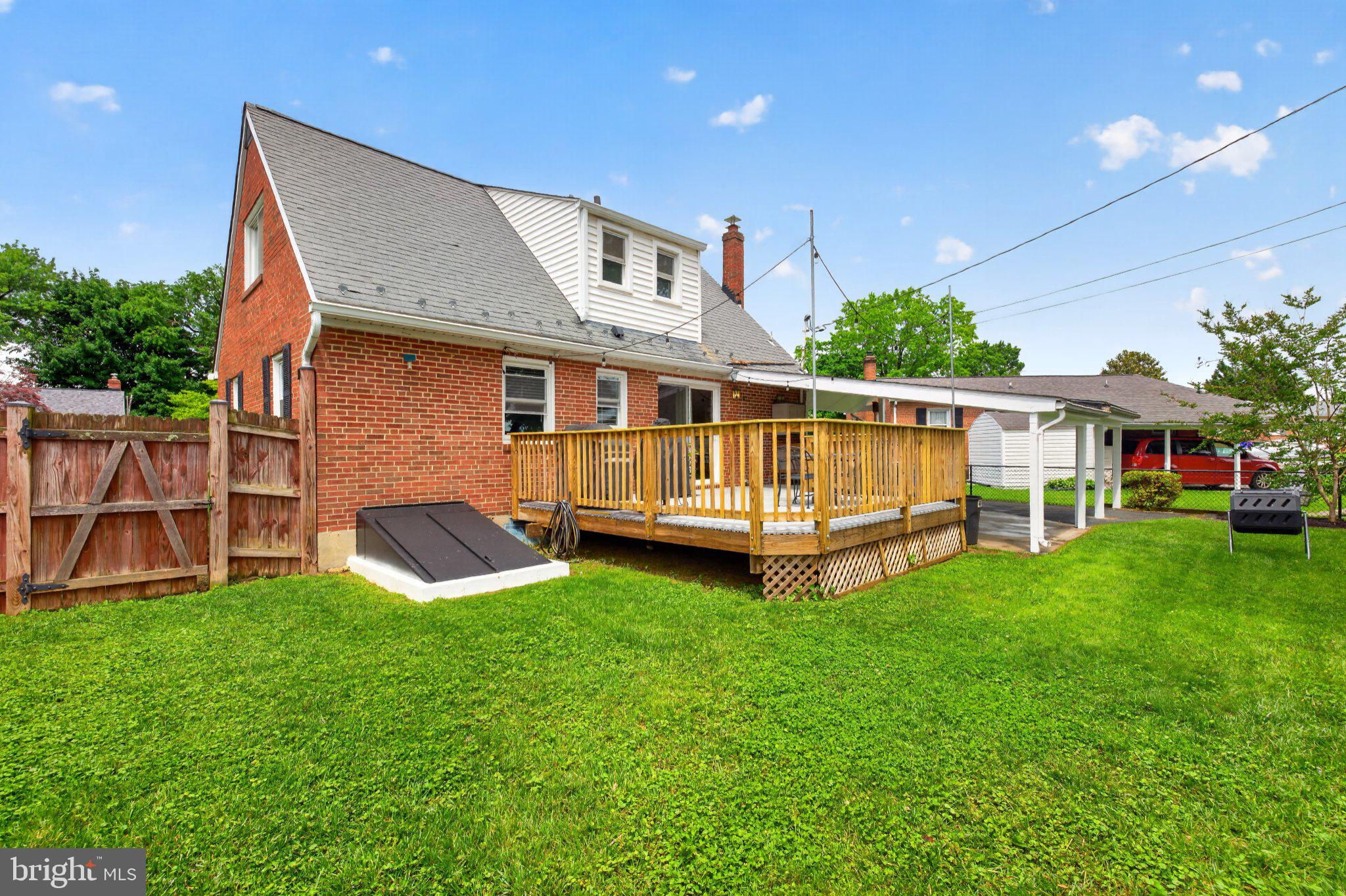 1002 Wilson Place Frederick, MD 21702 - Photo 27 of 30 a view of a house with a backyard and a patio