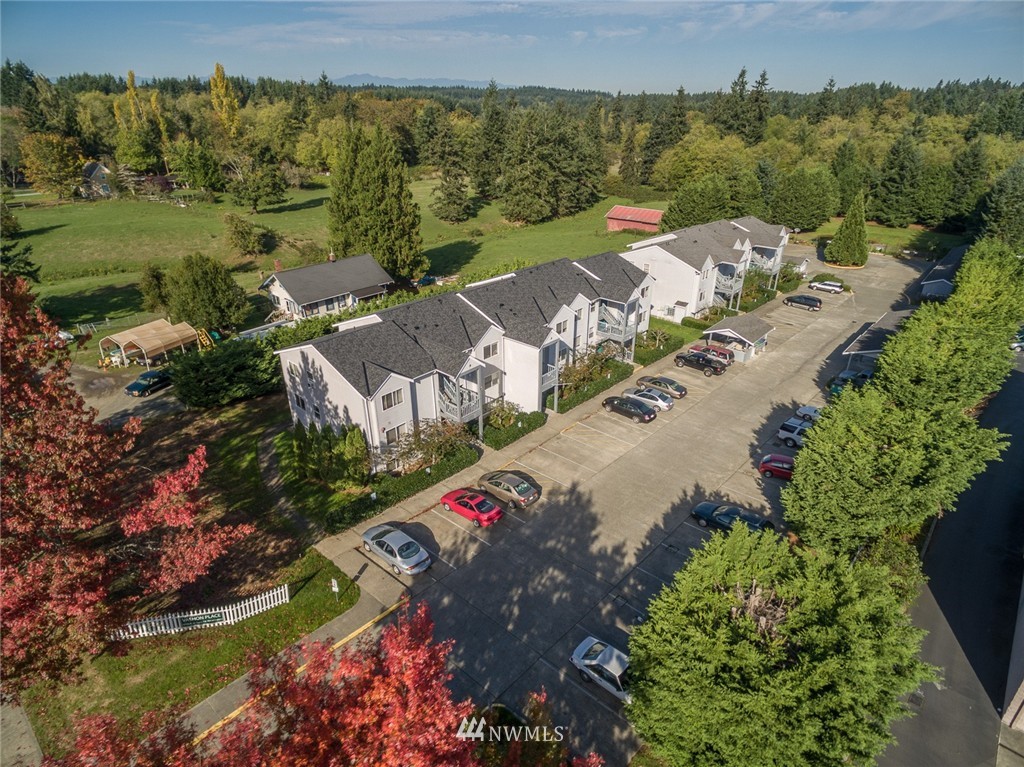 10106 Southwest Bank Road Vashon, WA 98070 - Photo 1 of 1 an aerial view of a house with a garden