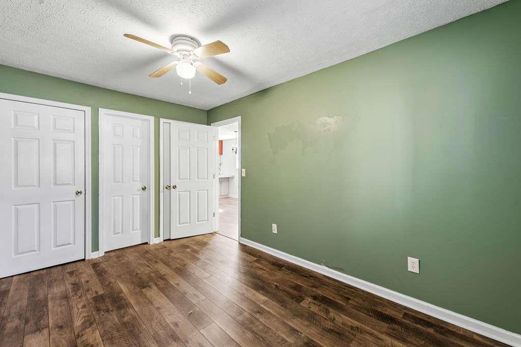 118 Jordan Road Blairsville, GA 30512 - Photo 27 of 49 wooden floor in an empty room with a chandelier fan