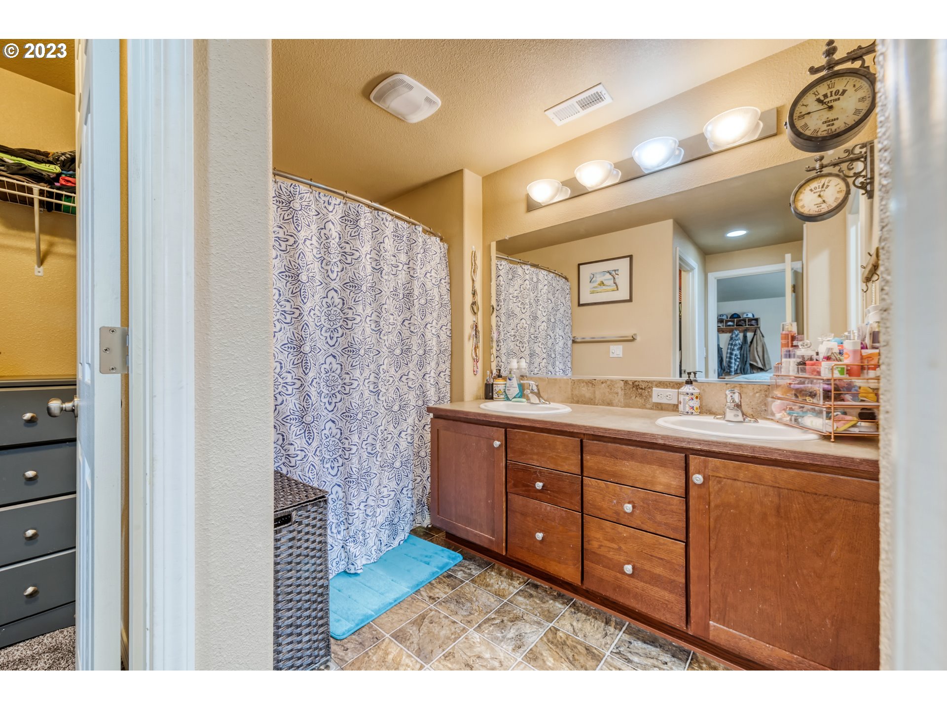 237 Rowan Street Roseburg, OR 97471 - Photo 19 of 35 a bathroom with a granite countertop sink a mirror and a shower