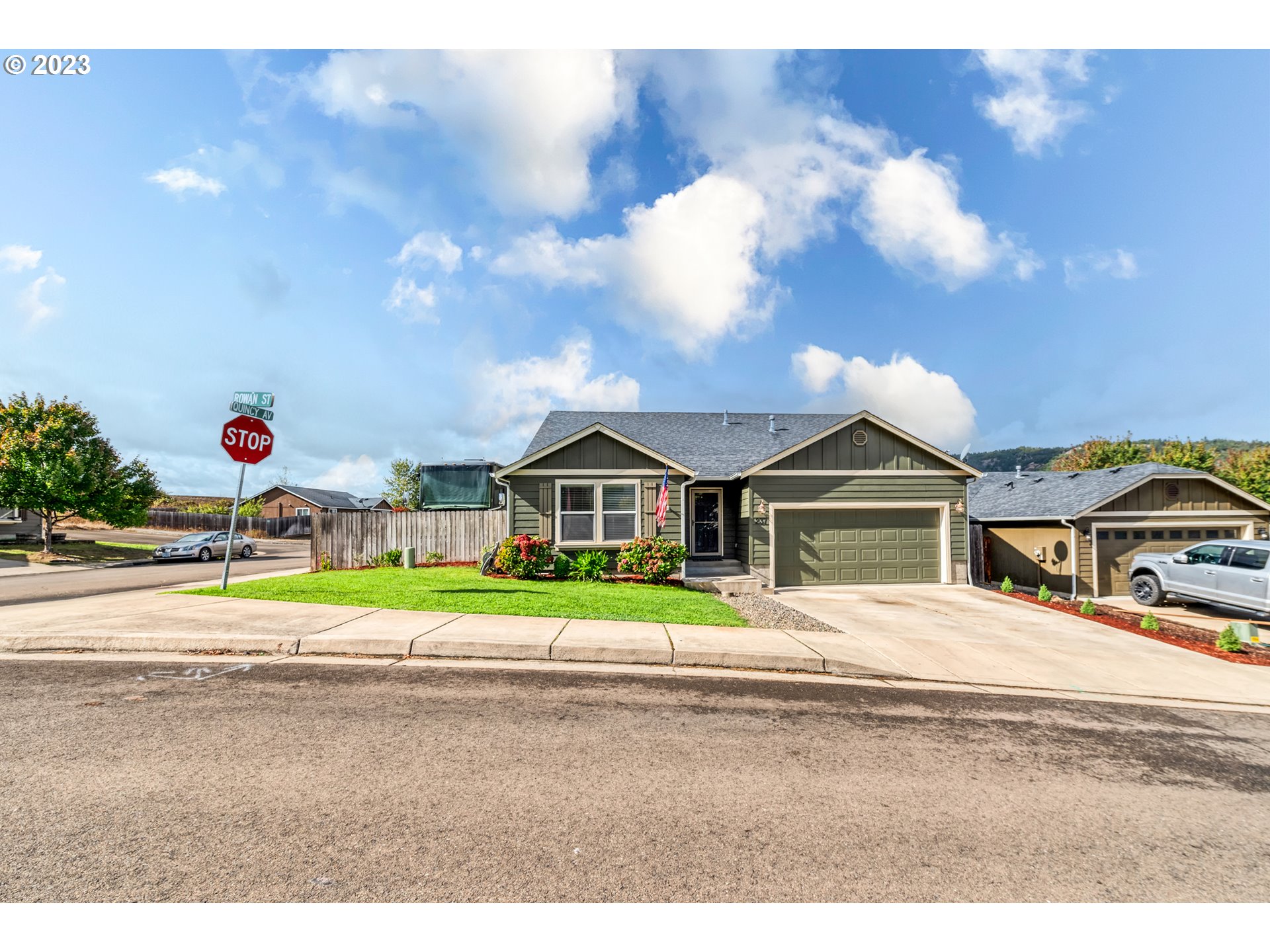 237 Rowan Street Roseburg, OR 97471 - Photo 2 of 35 a front view of a house with a big yard and potted plants