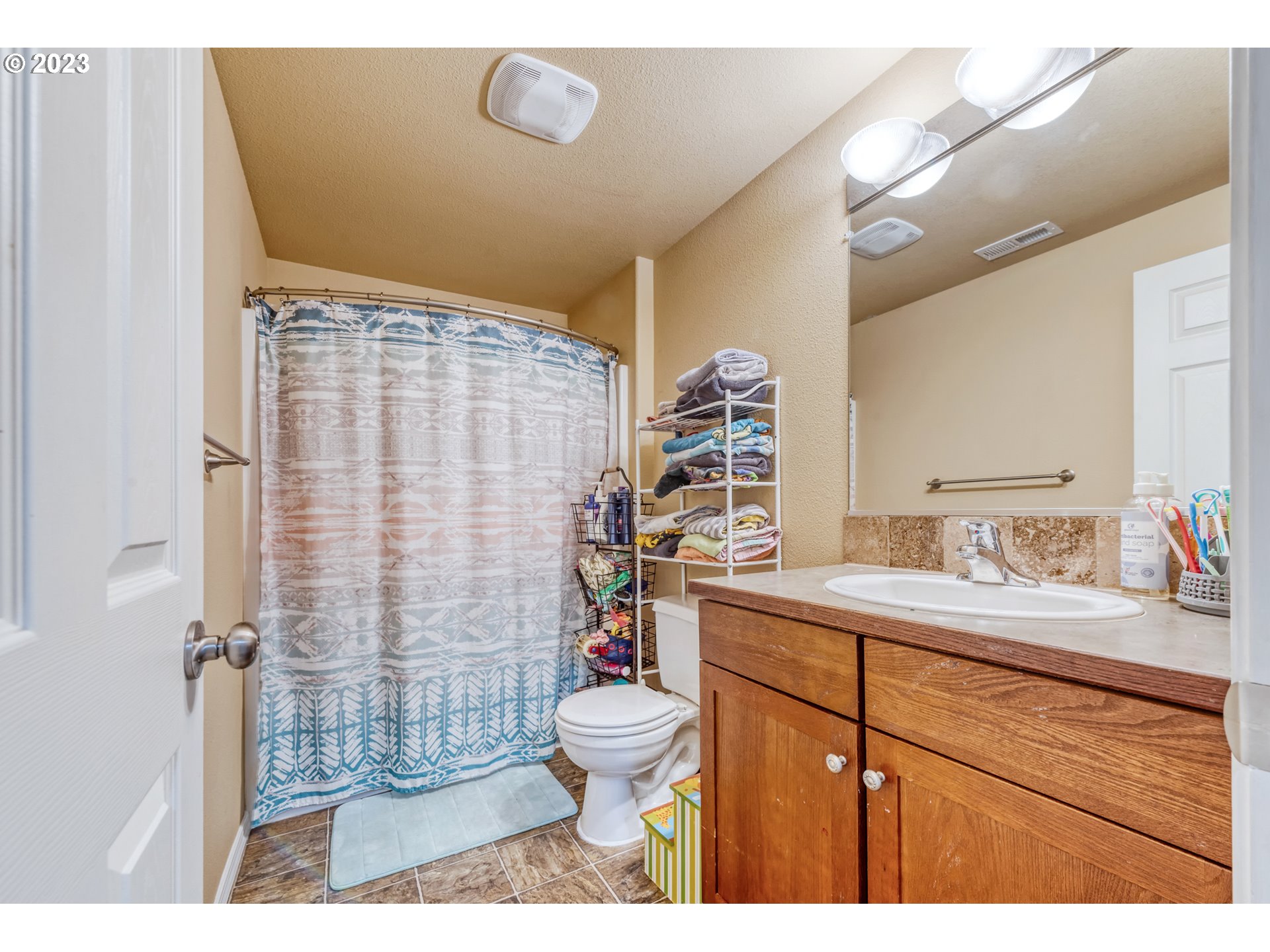 237 Rowan Street Roseburg, OR 97471 - Photo 24 of 35 a bathroom with a sink a toilet and shower