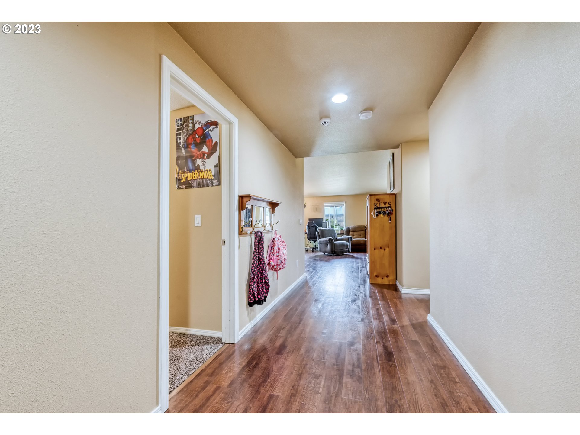 237 Rowan Street Roseburg, OR 97471 - Photo 6 of 35 a view of a hallway with wooden floor
