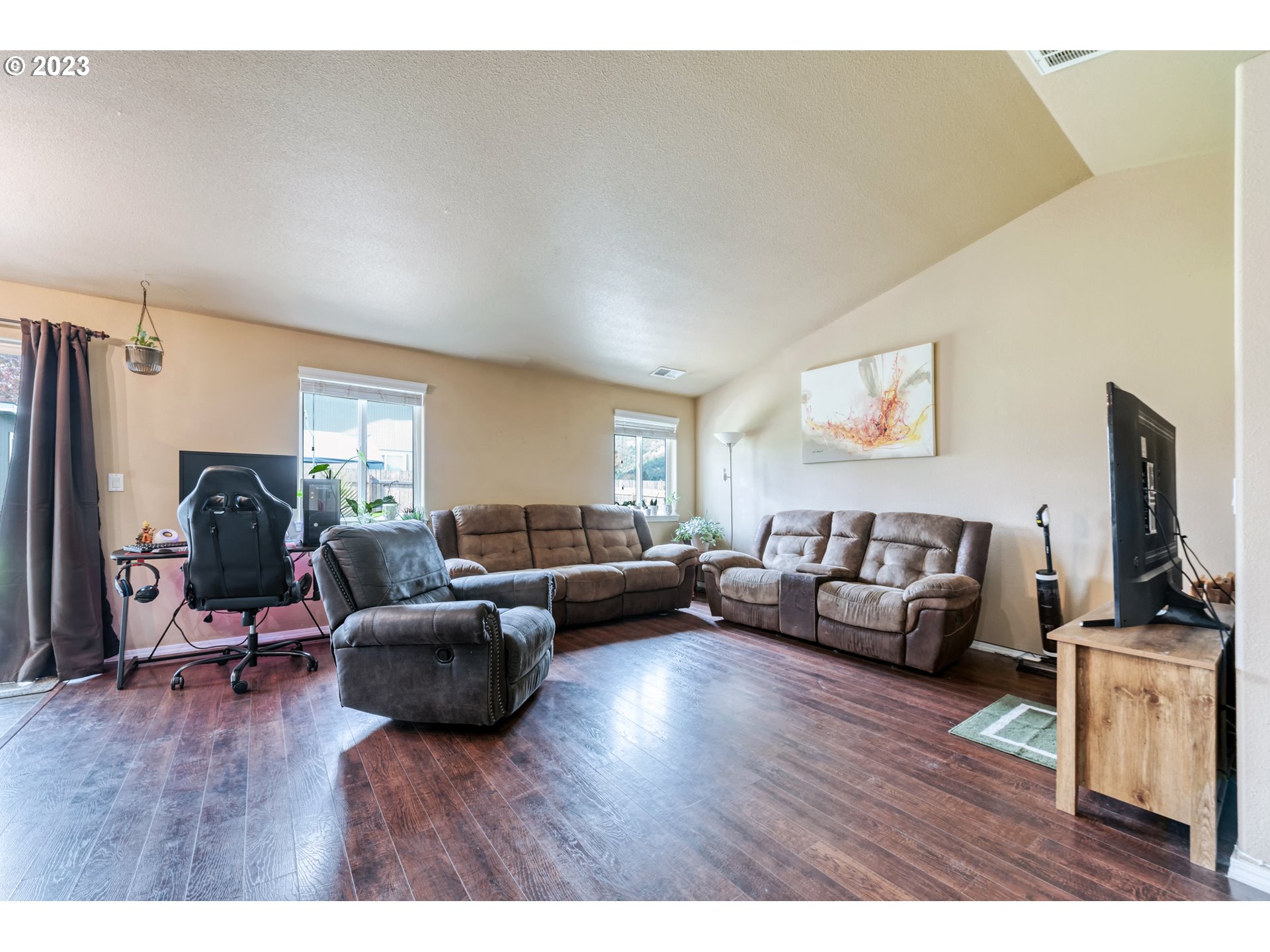 237 Rowan Street Roseburg, OR 97471 - Photo 7 of 35 a living room with furniture flat screen tv and a couch