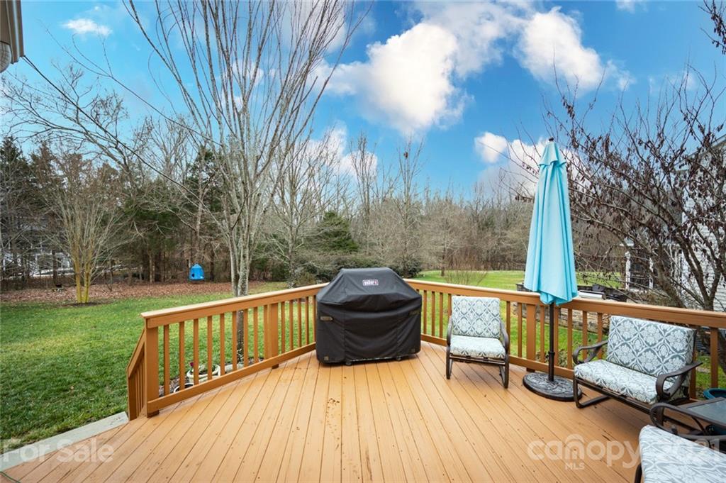 281 Lorraine Road Fort Mill, SC 29708 - Photo 3 of 29 a view of a roof deck with couches and wooden floor