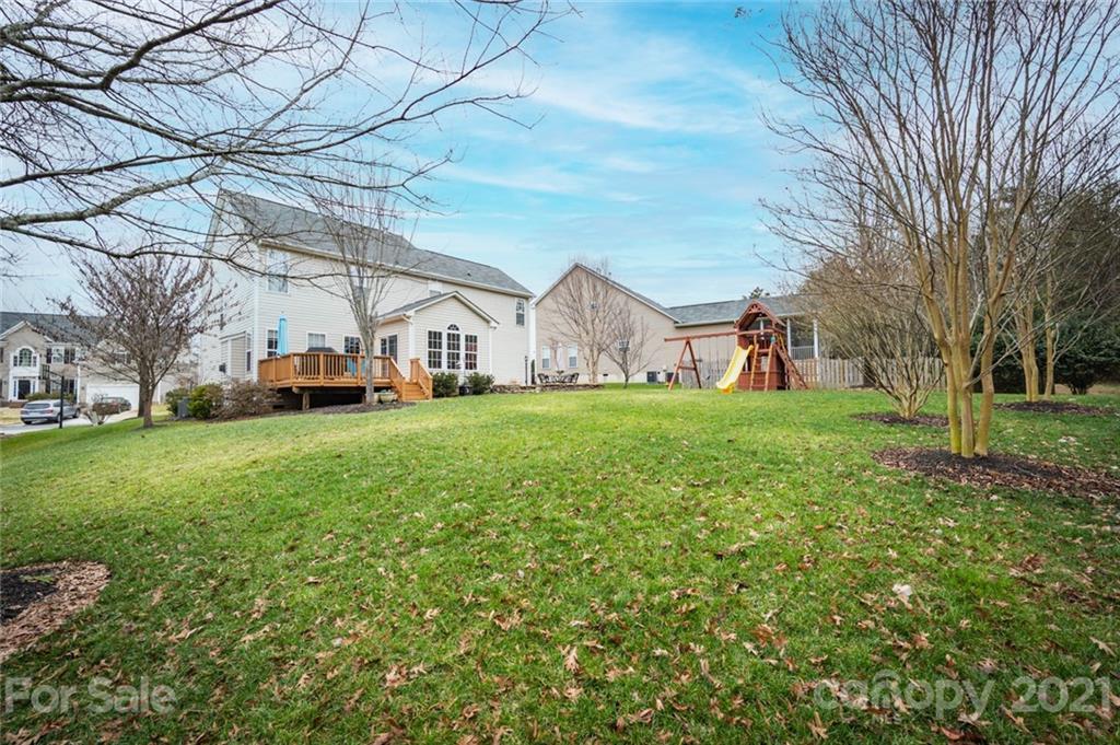 281 Lorraine Road Fort Mill, SC 29708 - Photo 5 of 29 a view of a yard with a house in the background