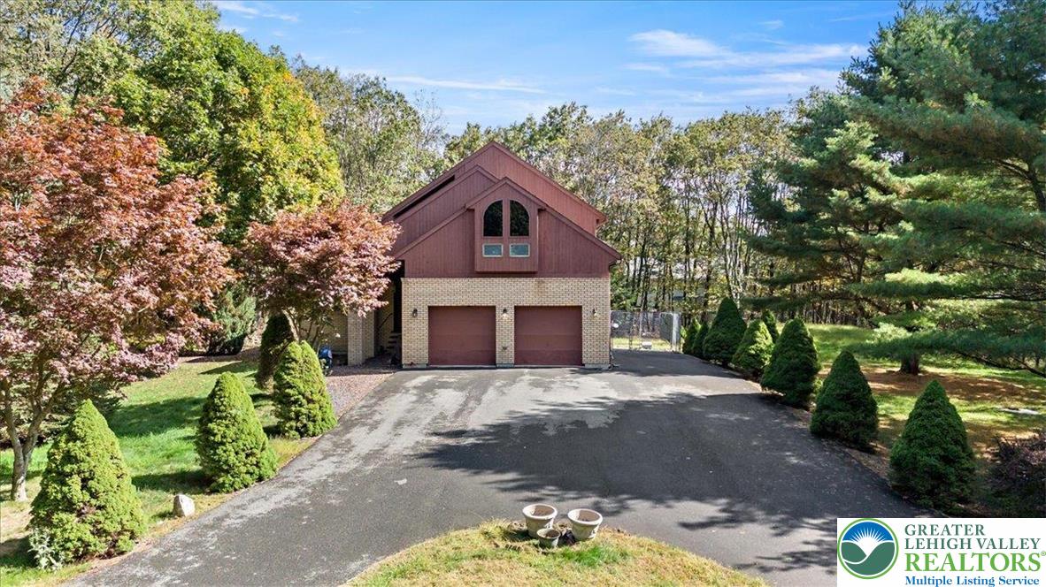 131 Stone Ridge Albrightsville, PA 18210 - Photo 2 of 51 a front view of a house with a garden