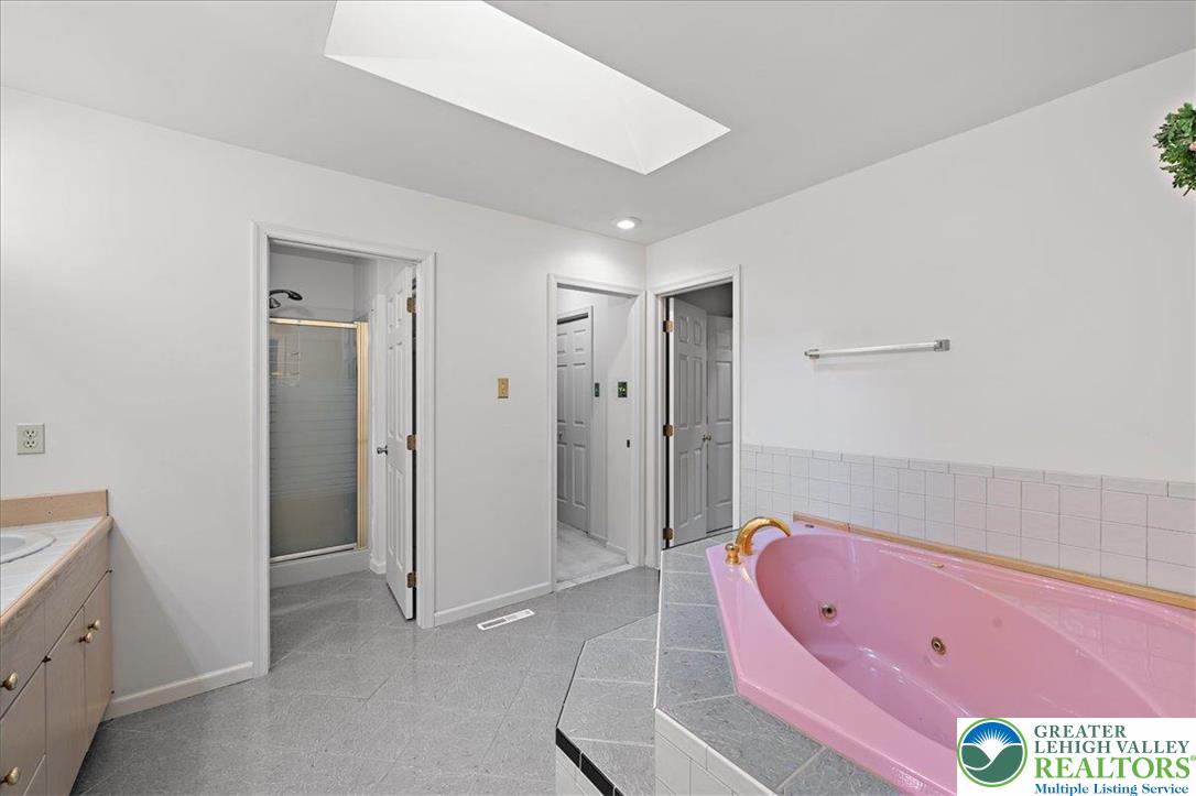 131 Stone Ridge Albrightsville, PA 18210 - Photo 24 of 51 a bathroom with a tub shower vanity and a sink