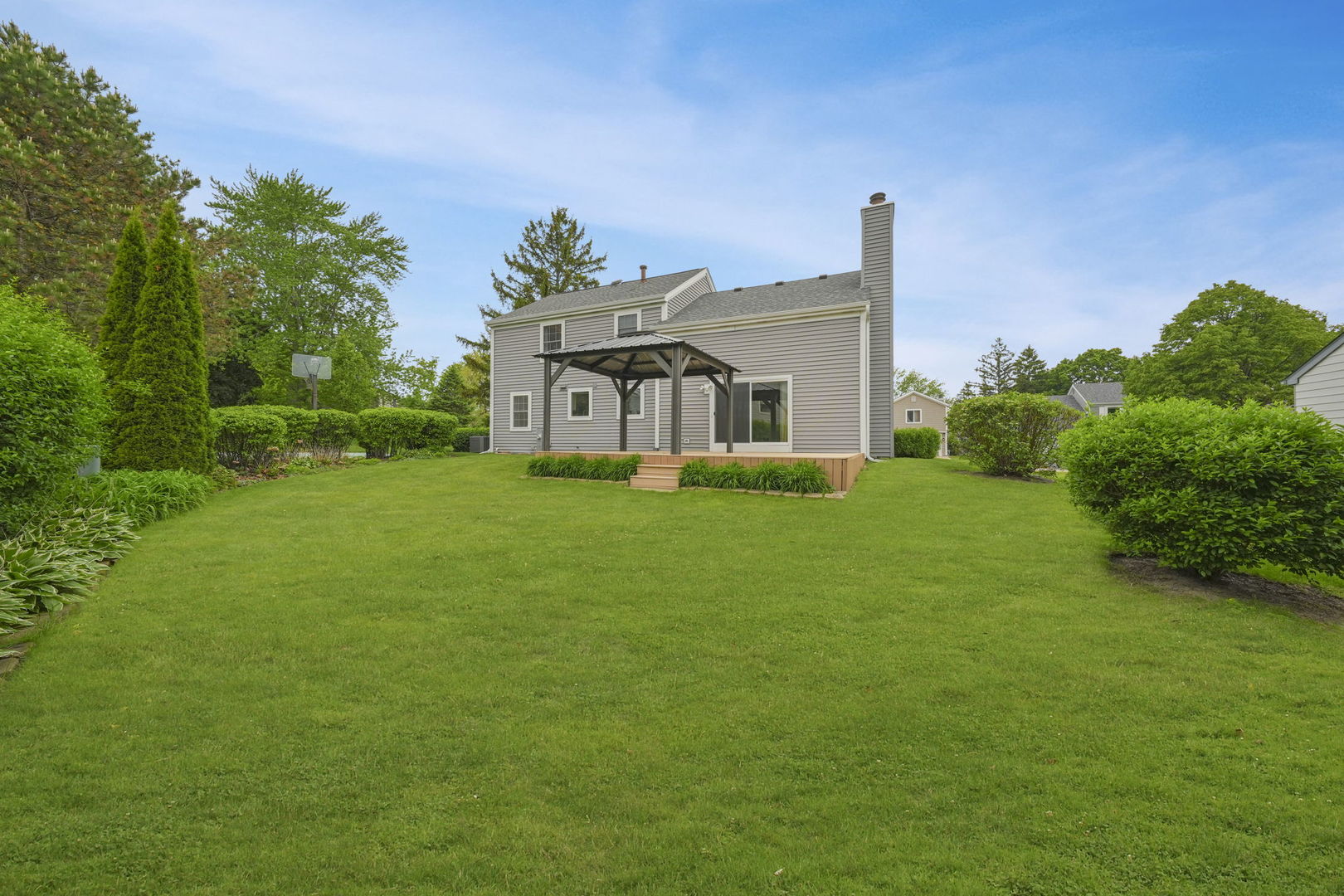 4977 Prairie Oak Road Gurnee, IL 60031 - Photo 2 of 26 a view of a house with a big yard