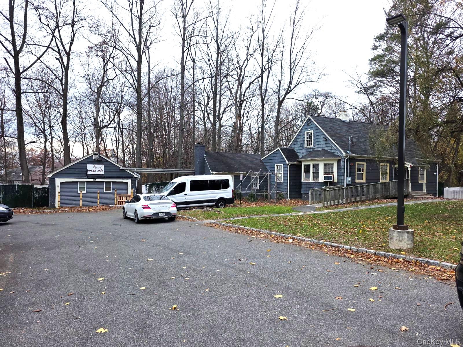 93 College Road Monsey, NY 10952 - Photo 4 of 10 a front view of a house with garden