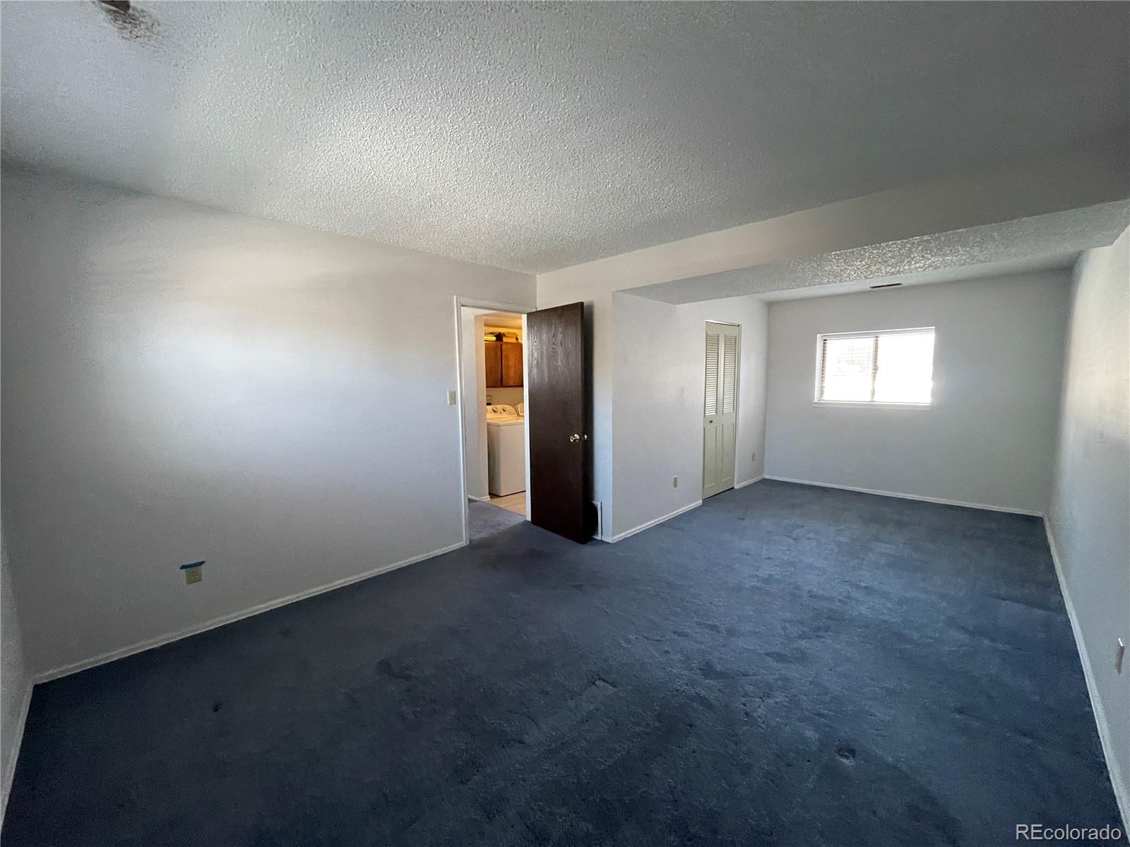 2955 Quincy Place Colorado Springs, CO 80916 - Photo 14 of 33 an empty room with windows