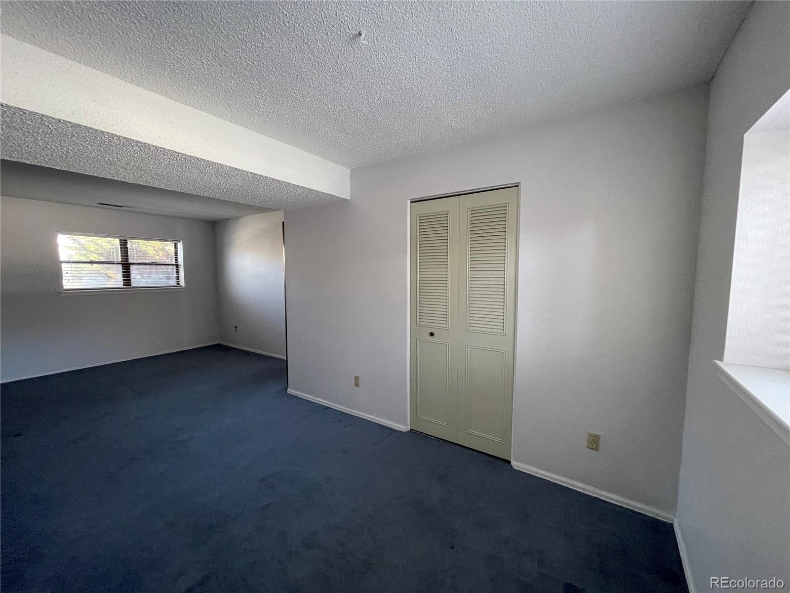 2955 Quincy Place Colorado Springs, CO 80916 - Photo 15 of 33 an empty room with windows