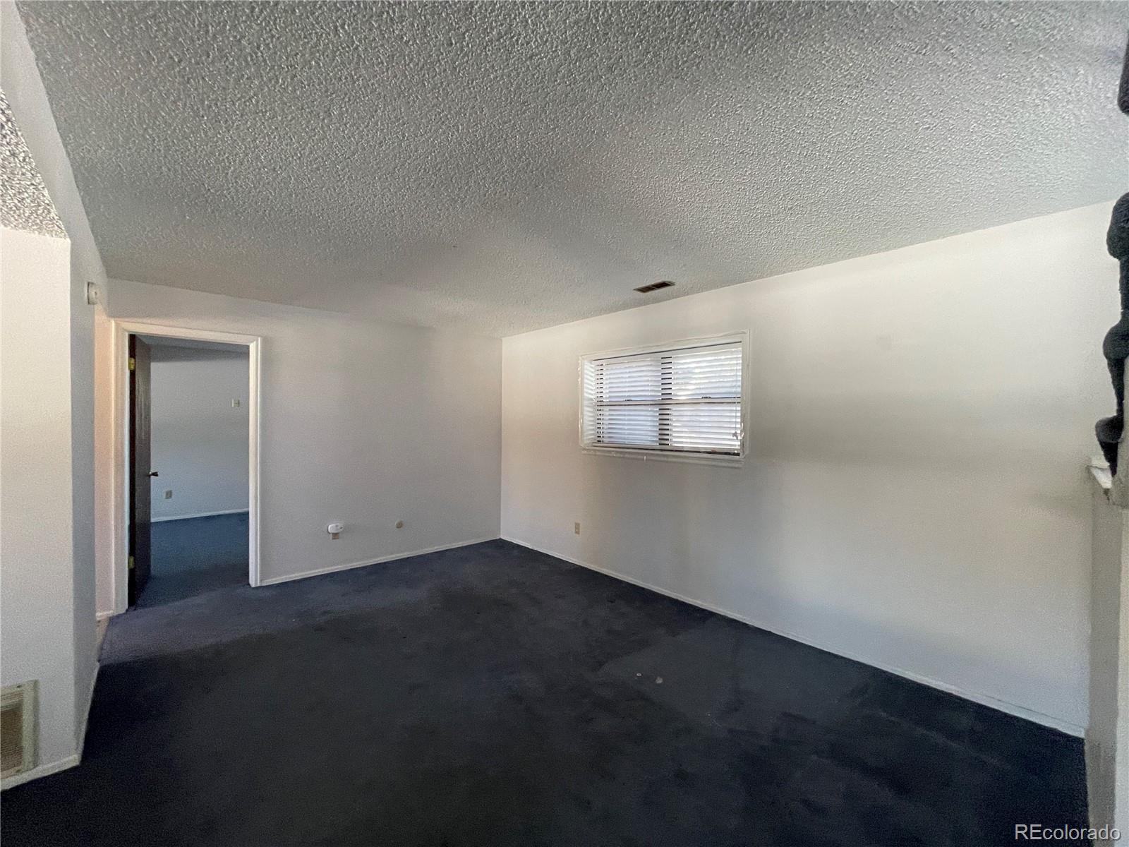 2955 Quincy Place Colorado Springs, CO 80916 - Photo 16 of 33 an empty room with windows