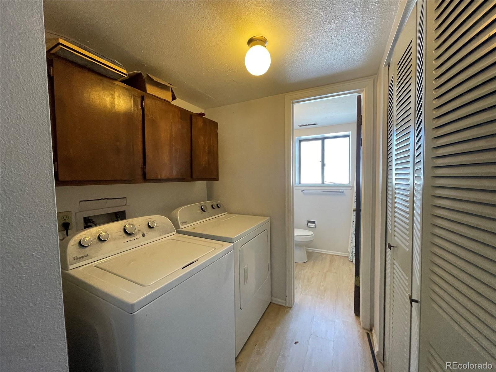 2955 Quincy Place Colorado Springs, CO 80916 - Photo 23 of 33 a view of a hallway with wooden floor