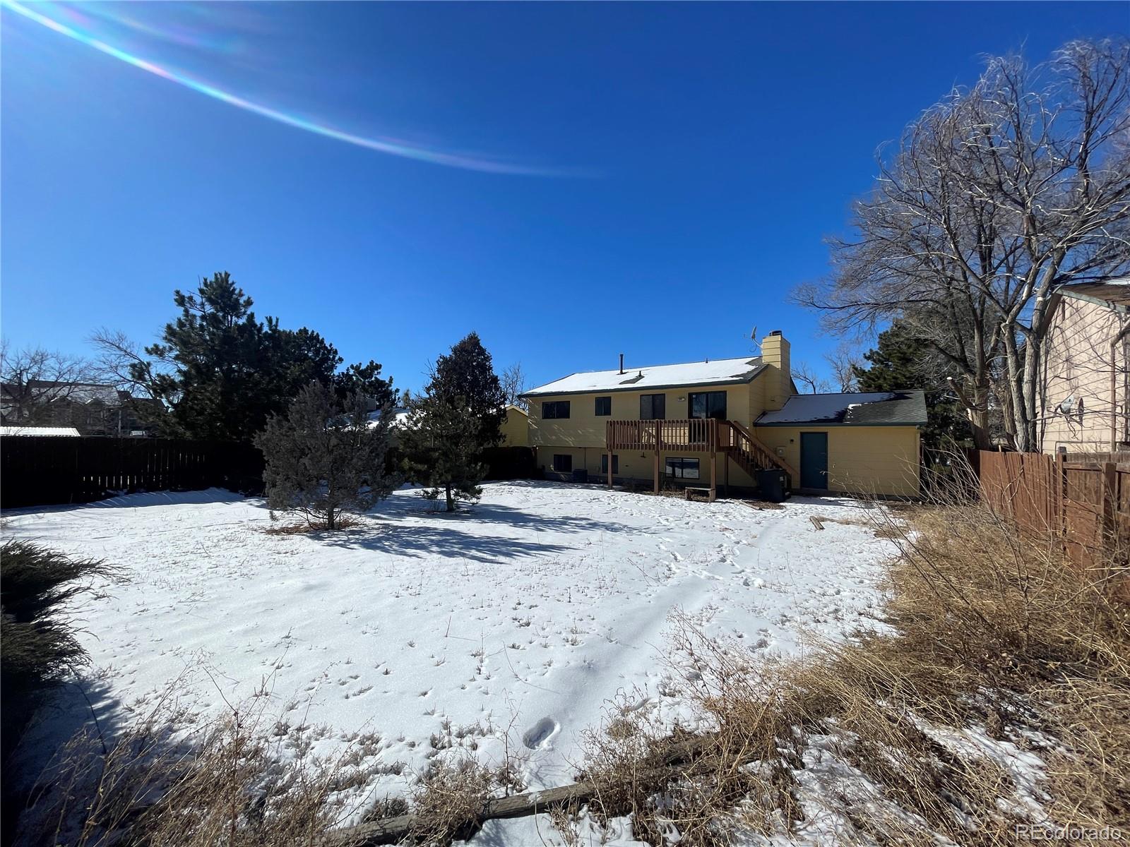 2955 Quincy Place Colorado Springs, CO 80916 - Photo 30 of 33 a front view of a house with a yard