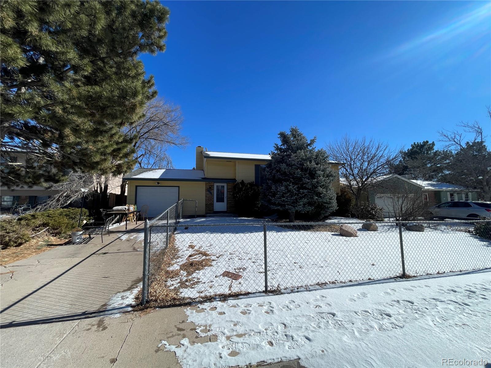 2955 Quincy Place Colorado Springs, CO 80916 - Photo 33 of 33 a view of a backyard of the house