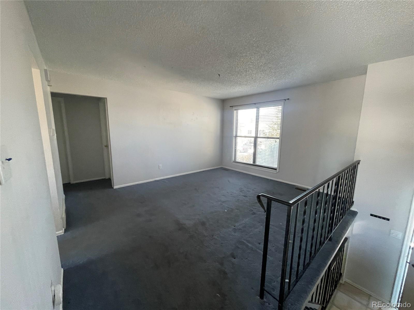 2955 Quincy Place Colorado Springs, CO 80916 - Photo 6 of 33 an empty room with windows