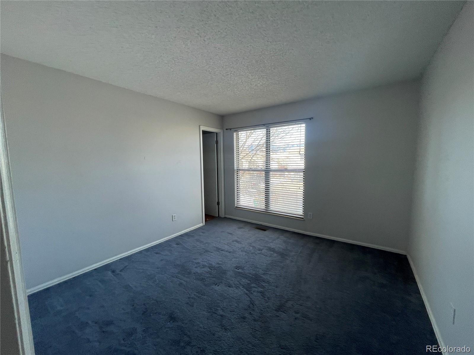 2955 Quincy Place Colorado Springs, CO 80916 - Photo 7 of 33 an empty room with a window