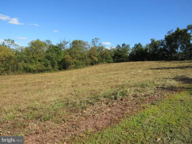 a view of a field with an outdoor space