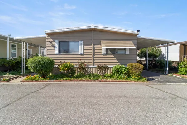 a front view of house with street