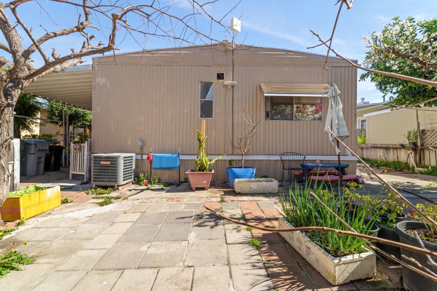5450 Monterey Road, Unit 157 San Jose, CA 95111 - Photo 22 of 30 a view of a patio with chairs and potted plants