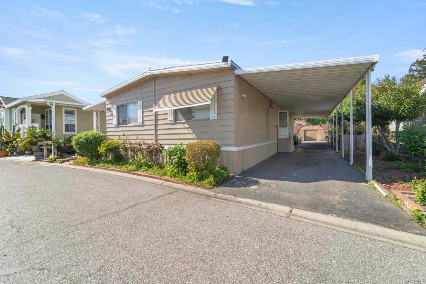 5450 Monterey Road, Unit 157 San Jose, CA 95111 - Photo 28 of 30 a front view of a house with a yard and a garage