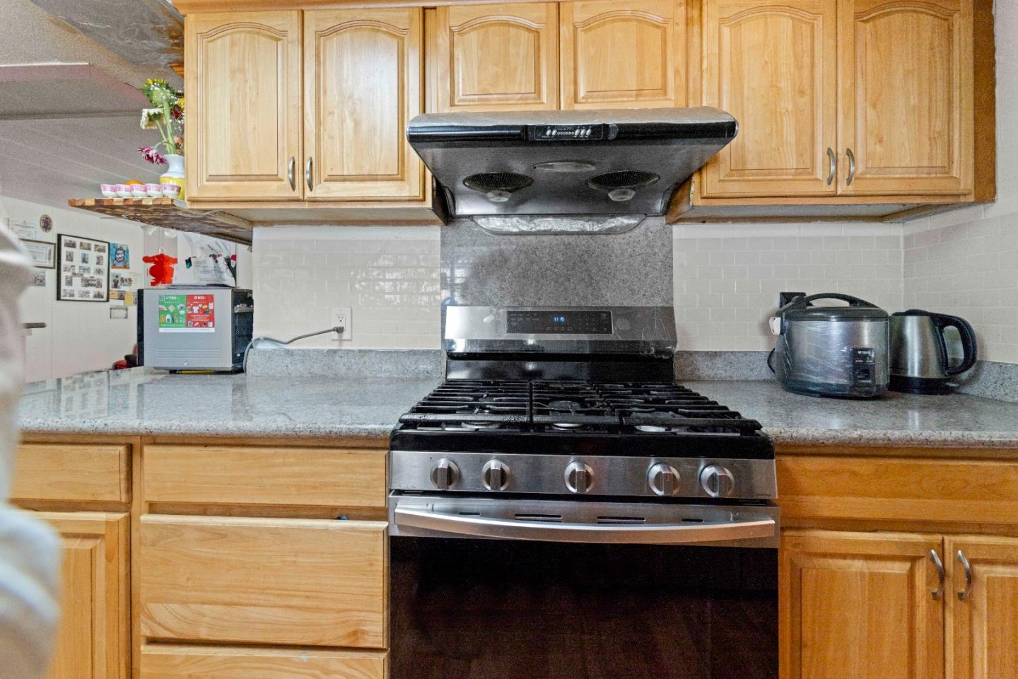 5450 Monterey Road, Unit 157 San Jose, CA 95111 - Photo 9 of 30 a stove top oven sitting inside of a kitchen