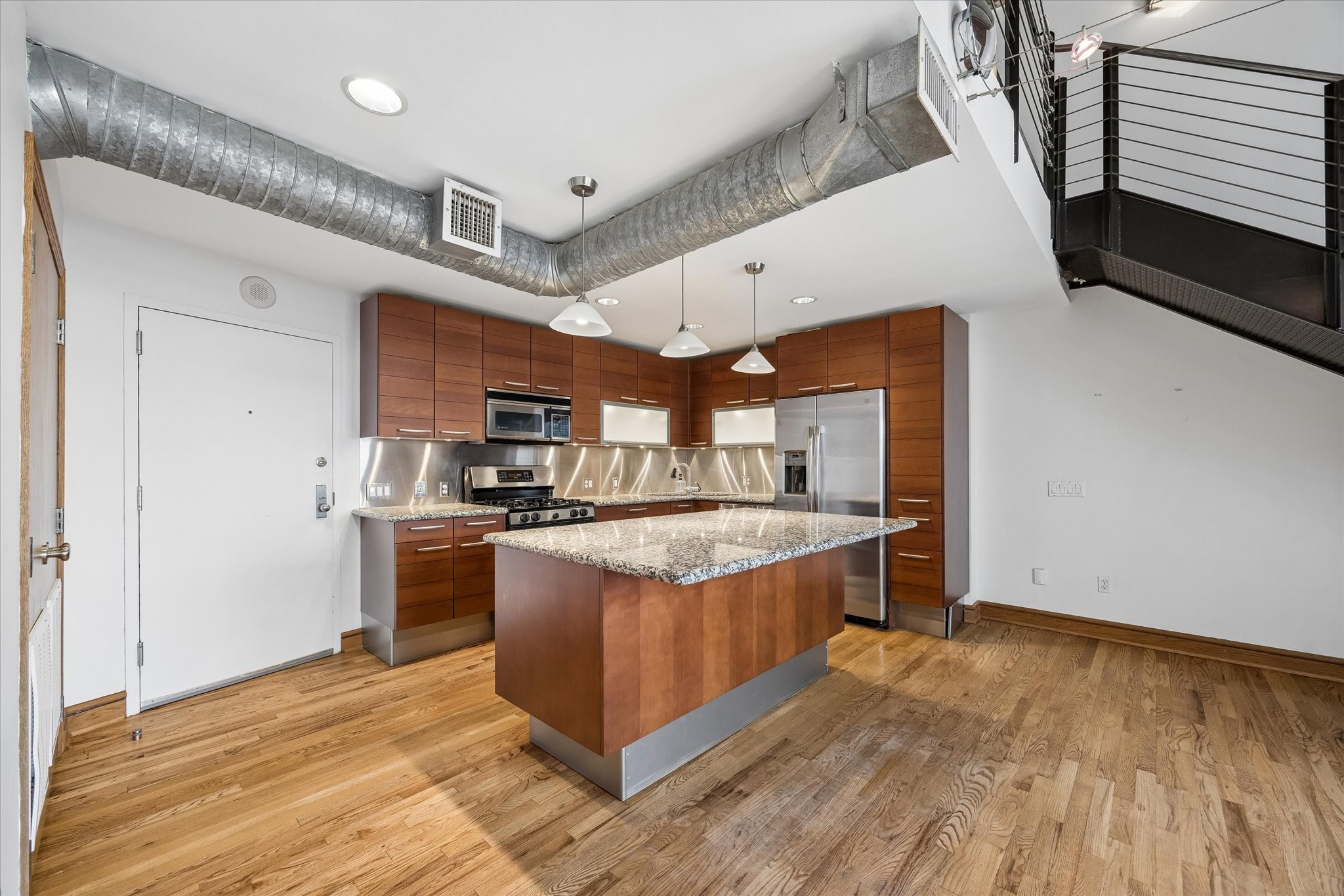 915 Franklin Street, Unit 9L Houston, TX 77002 - Photo 12 of 50 Designer kitchen with a spacious island and premium Poggenpohl cabinetry.