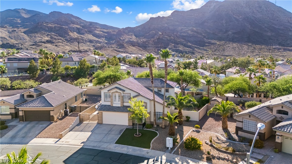 708 Vortex Avenue Henderson, NV 89002 - Photo 68 of 71 A desert oasis with mountain views and lush landscaping.