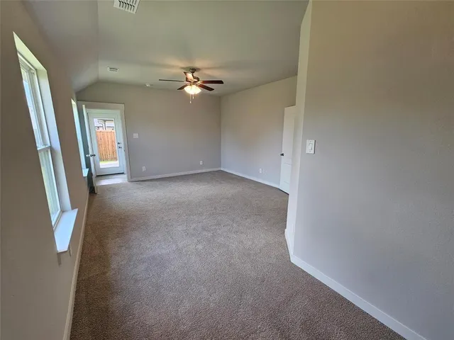 a bathroom with a tub a sink and a window