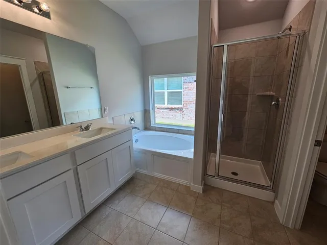 a bathroom with 2 sink and a mirror