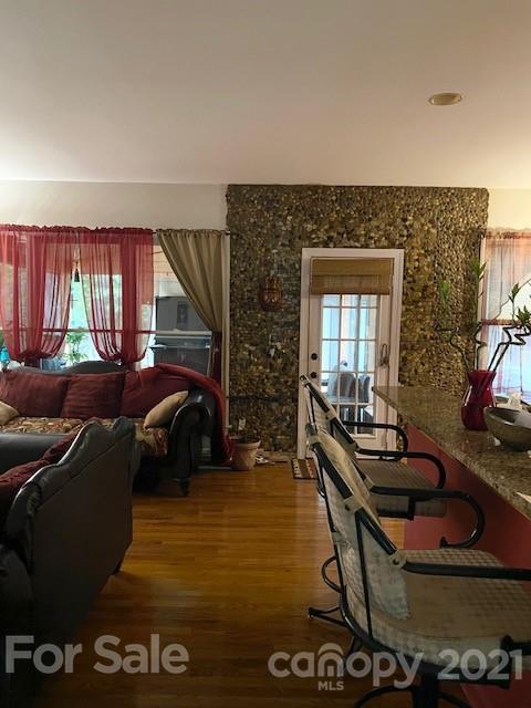 7923 Harrington Woods Road Charlotte, NC 28269 - Photo 11 of 15 a living room with furniture and a flat screen tv
