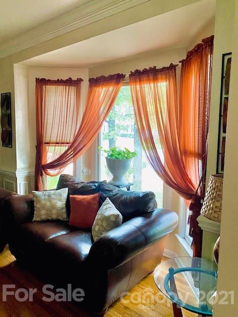 7923 Harrington Woods Road Charlotte, NC 28269 - Photo 15 of 15 a living room with furniture and a large window